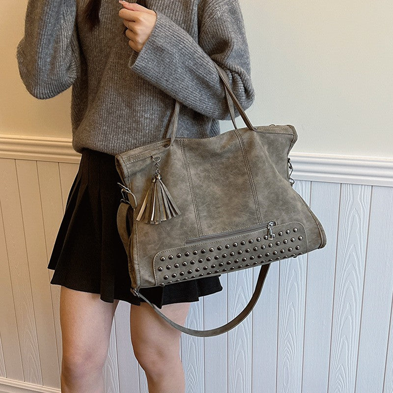 Studded Slouchy Tote Bag with Tassel Charm