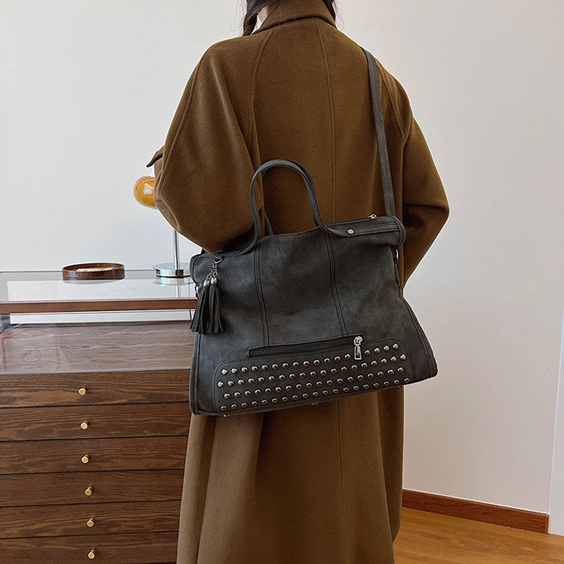 Studded Slouchy Tote Bag with Tassel Charm