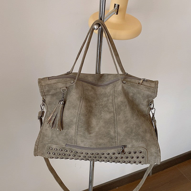Studded Slouchy Tote Bag with Tassel Charm