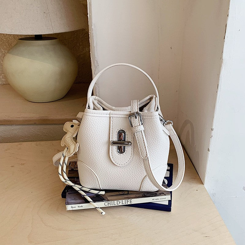 Mini Turn Lock Bucket Bag with Crossbody Strap - Cream Charm