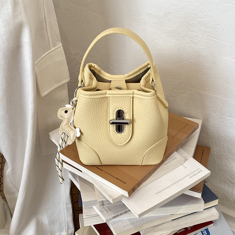 Mini Turn Lock Bucket Bag with Crossbody Strap - Yellow Charm