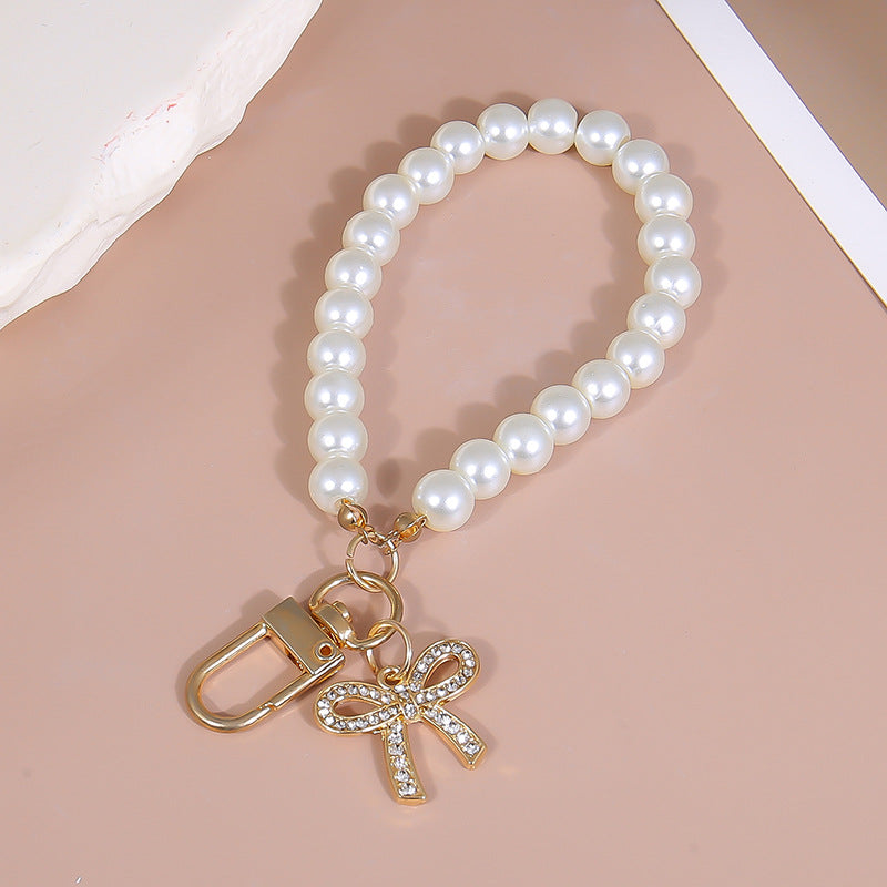 Pearl Wristlet Keychain With Bow Charm - Gold