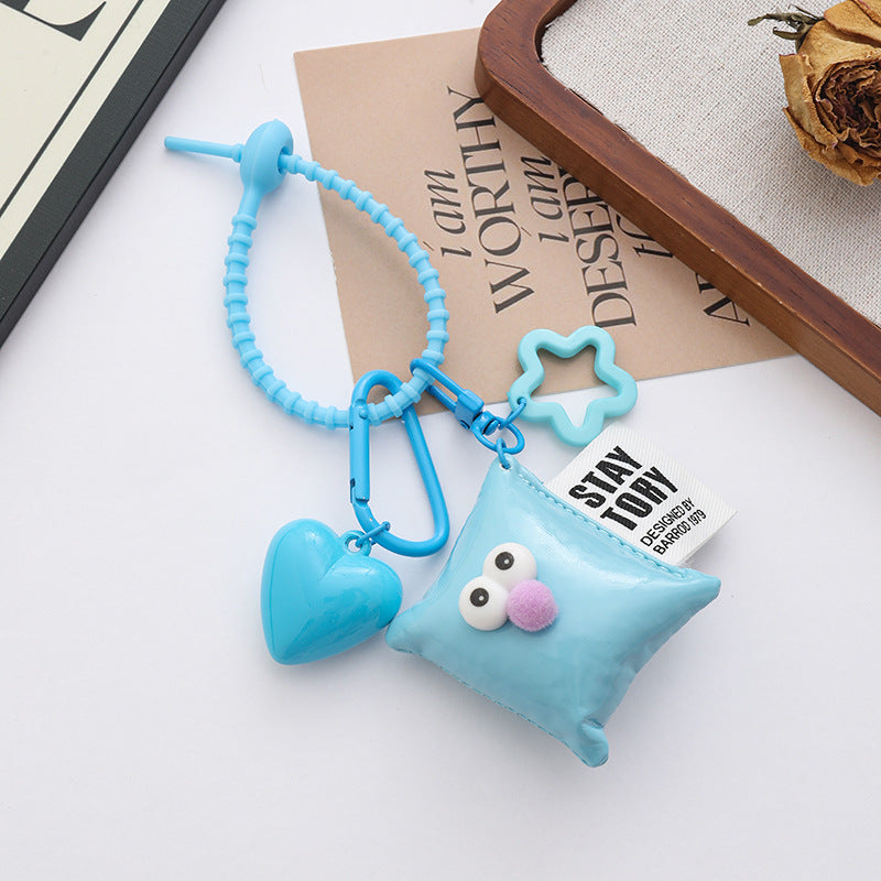 Smiley Pillow Charm With Heart Pendant - Blue