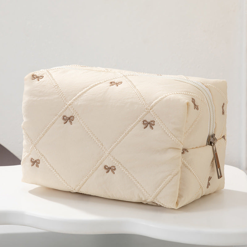 Padded Cosmetic Case With Embroidered Bows - Beige