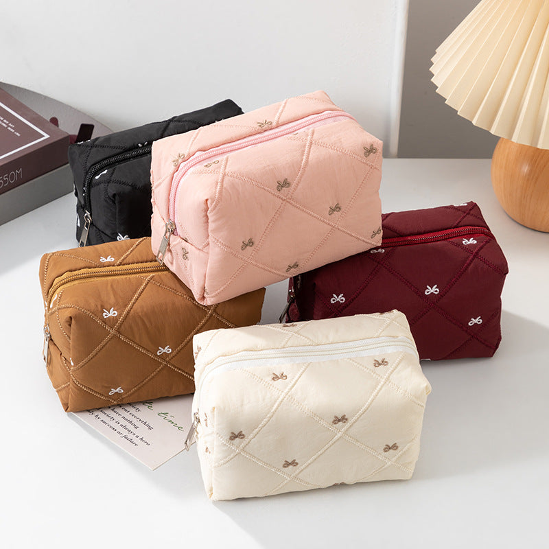 Padded Cosmetic Case With Embroidered Bows - view 1