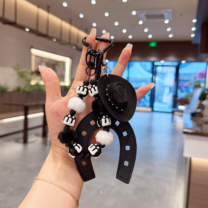 Cowboy Hat Horseshoe Charm Keychain With Pom Poms - Black