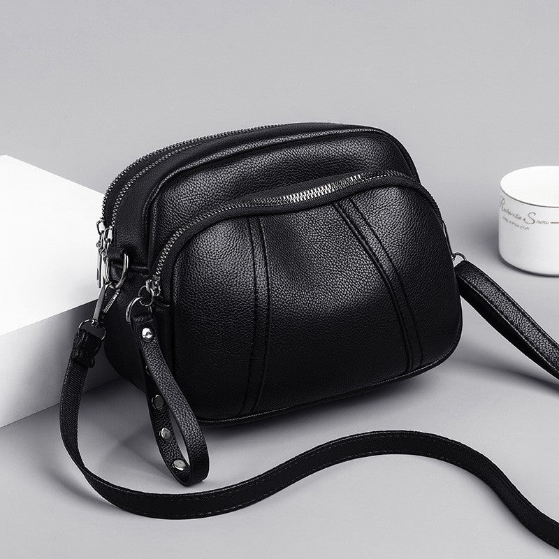 Pebbled Triple Zip Dome Crossbody Bag