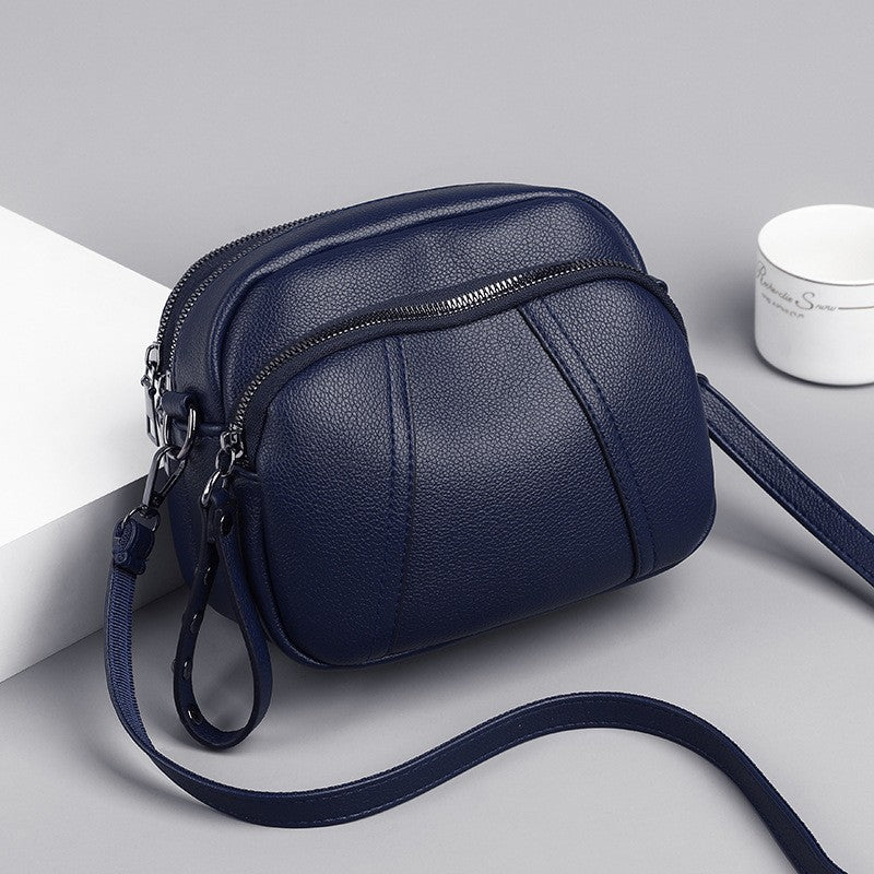 Pebbled Triple Zip Dome Crossbody Bag