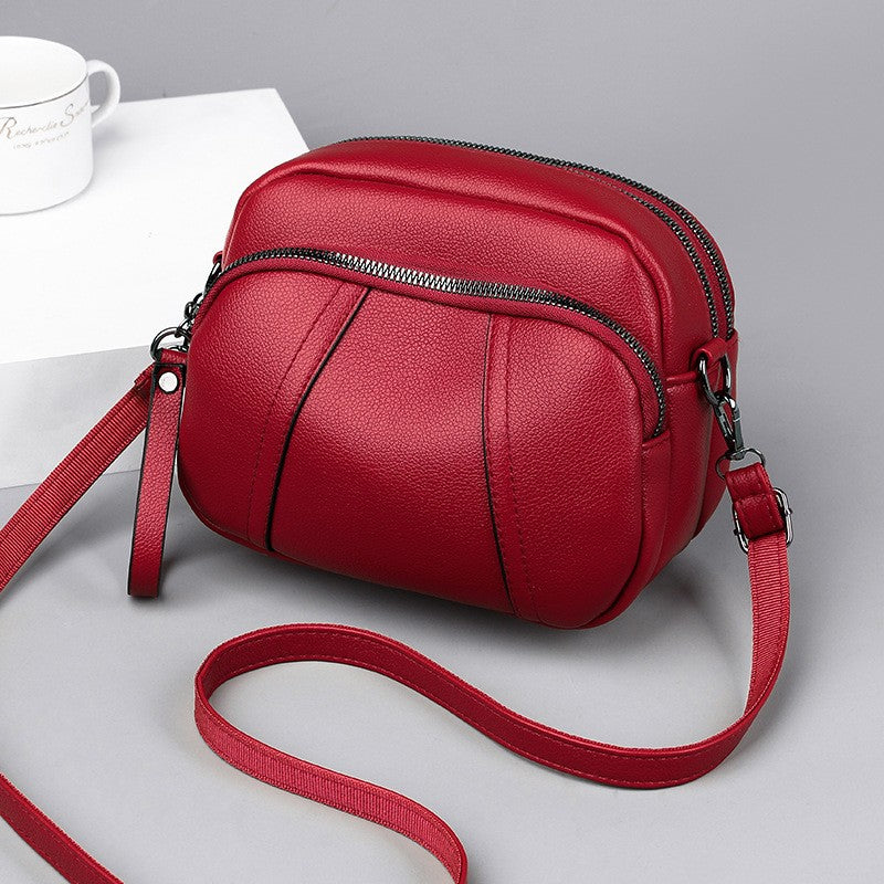 Pebbled Triple Zip Dome Crossbody Bag