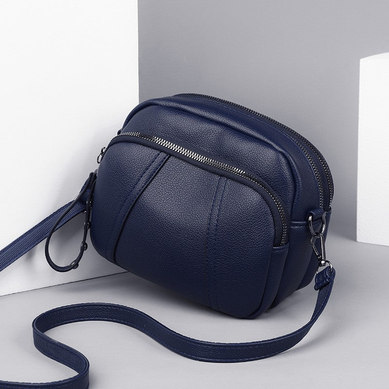 Pebbled Triple Zip Dome Crossbody Bag
