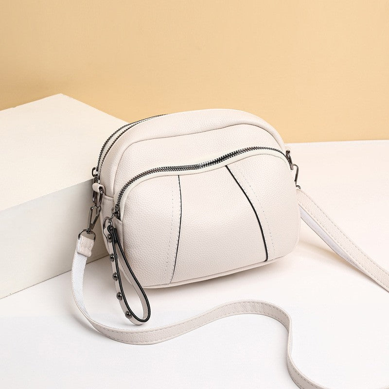 Pebbled Triple Zip Dome Crossbody Bag