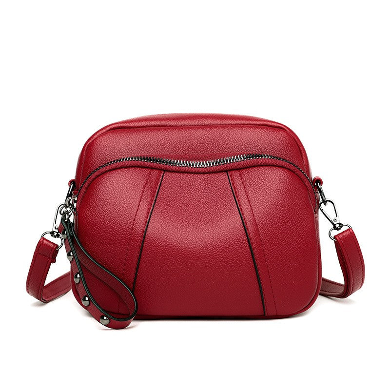Pebbled Triple Zip Dome Crossbody Bag