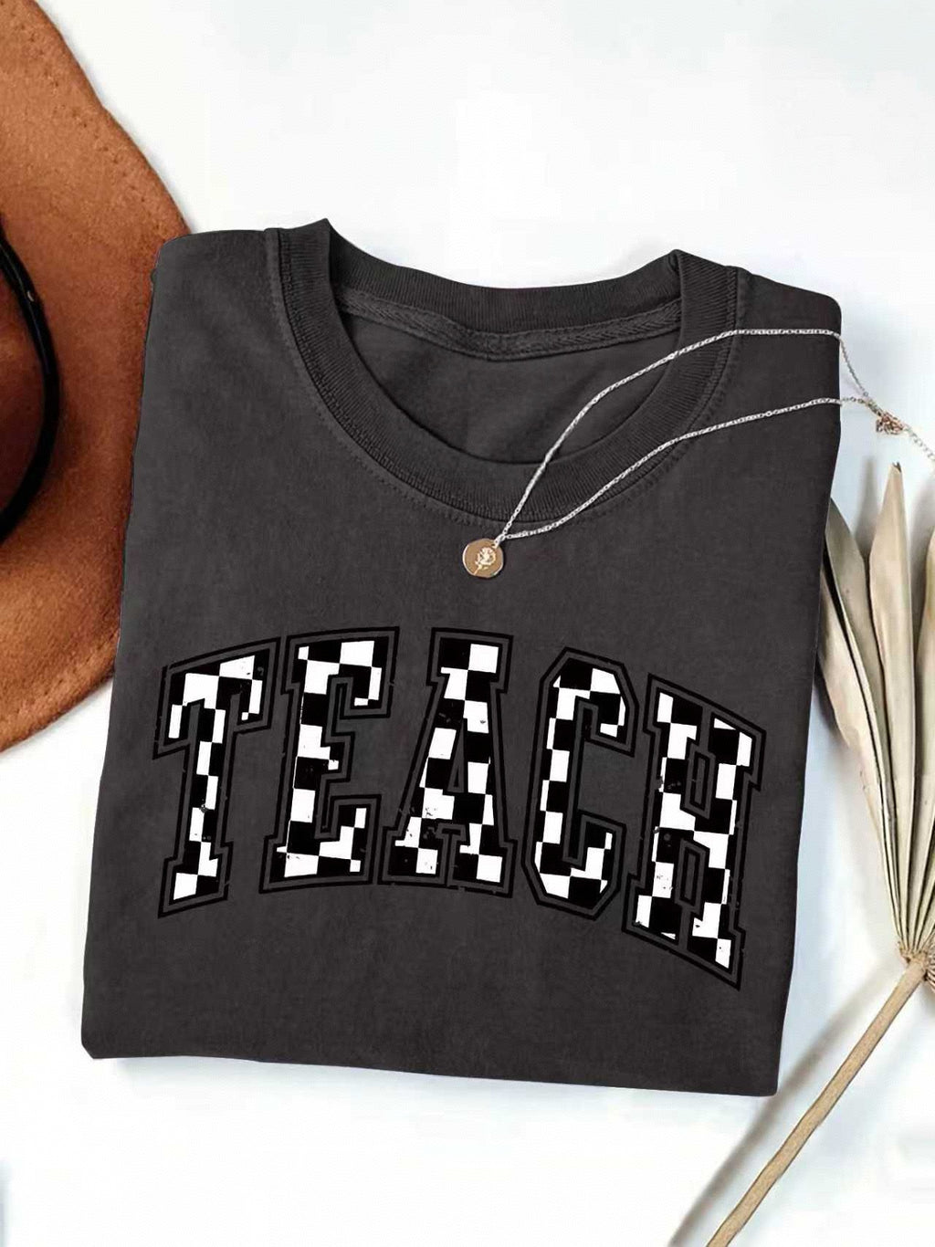 Checkerboard Teach Letter Print Teacher Tee - Black