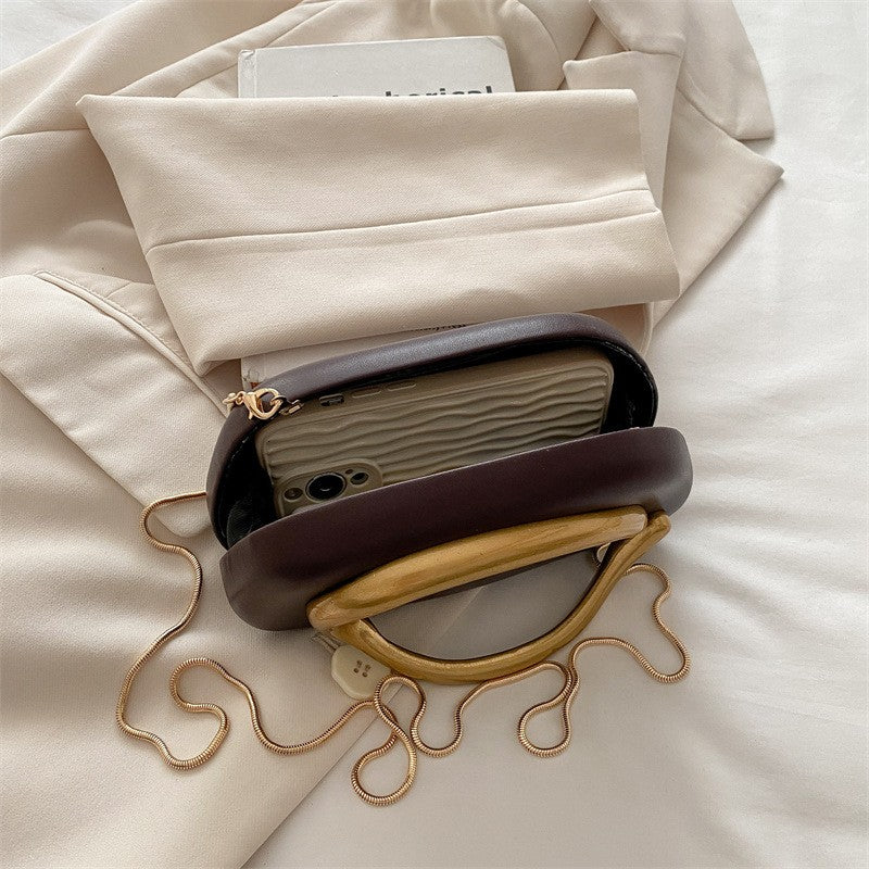 Oval Pillow Clutch with Curved Metal Handle