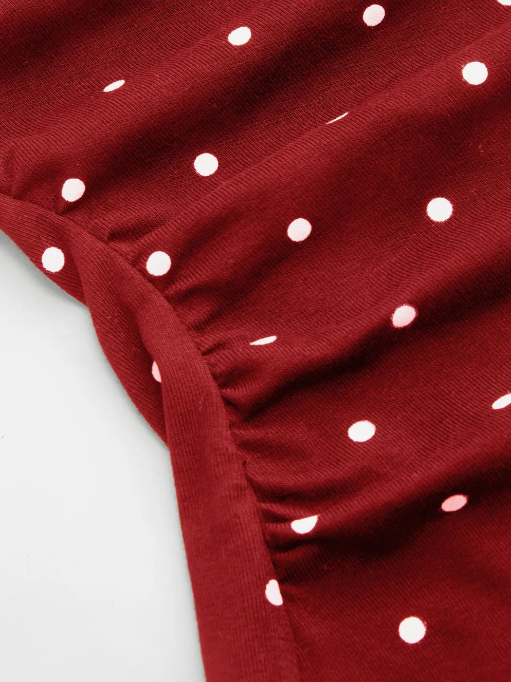 Ruched Polka Dot Knit Top With Bow Back - view 1