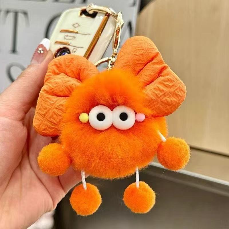 Quirky Googly-Eye Fuzzy Monster Pom-Pom Keychain - view 3