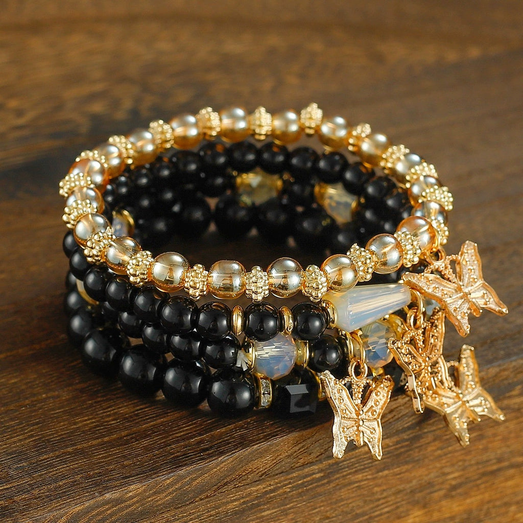Stacked Bead Coil Bracelet With Butterfly Drops - Black
