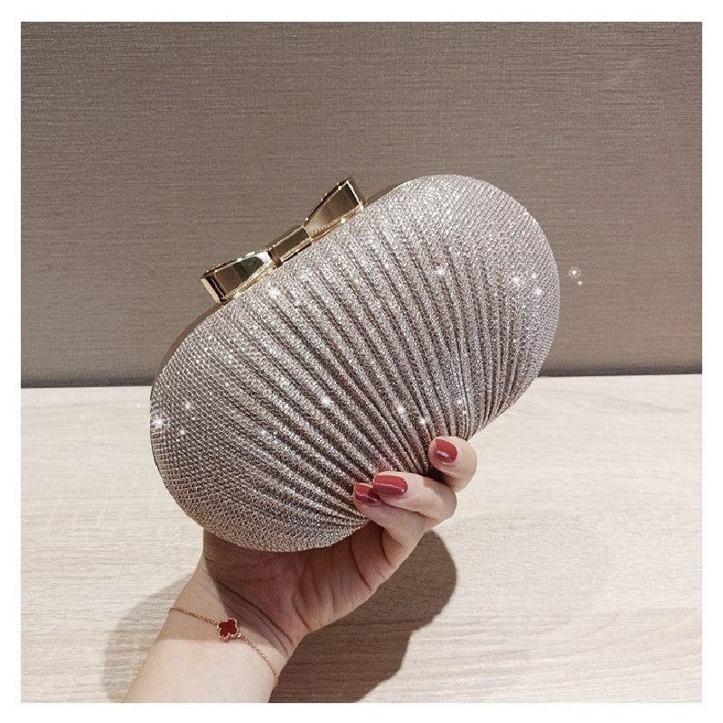 Pleated Glitter Egg Clutch with Bow Clasp