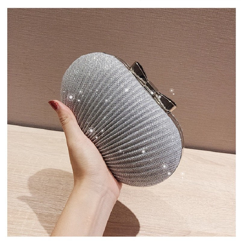 Pleated Glitter Egg Clutch with Bow Clasp
