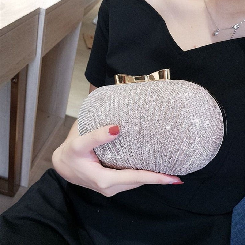 Pleated Glitter Egg Clutch with Bow Clasp