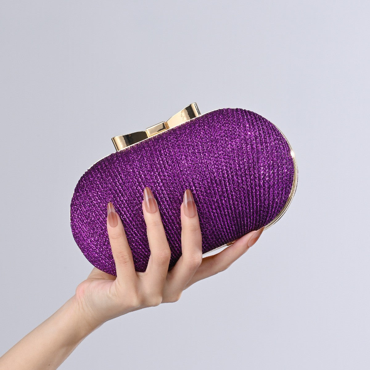 Pleated Glitter Egg Clutch with Bow Clasp