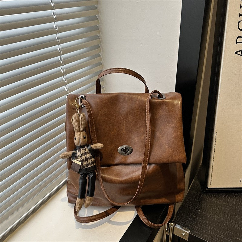 Slouchy Faux Leather Flap Backpack