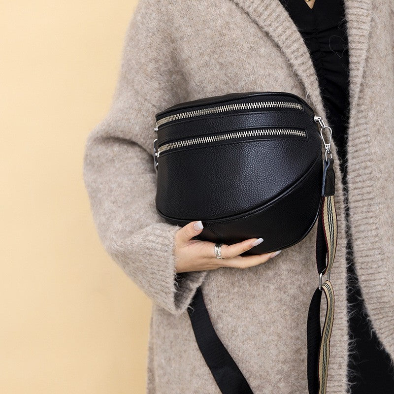 Pebbled Half Moon Crossbody Bag with Striped Strap - Black