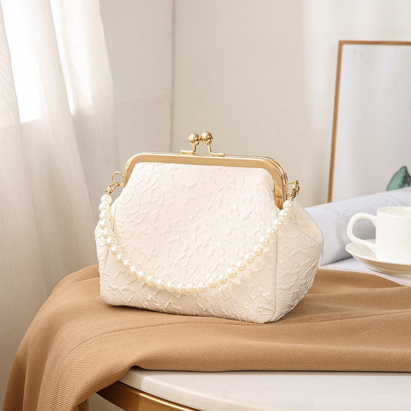 Embossed Kiss Lock Frame Bag with Pearl Handle
