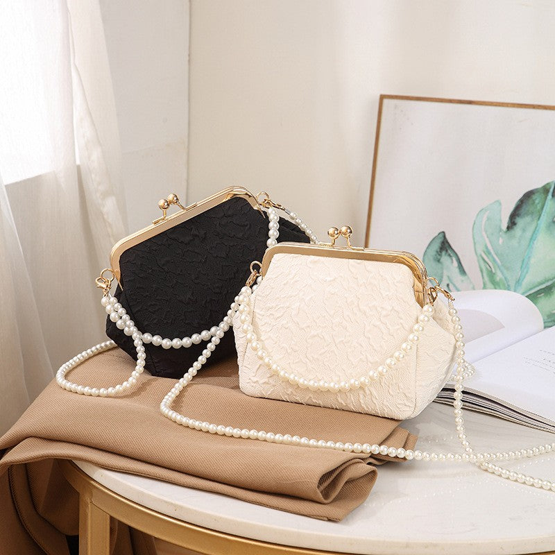 Embossed Kiss Lock Frame Bag with Pearl Handle