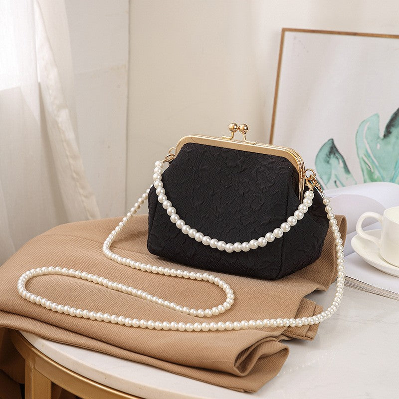Embossed Kiss Lock Frame Bag with Pearl Handle