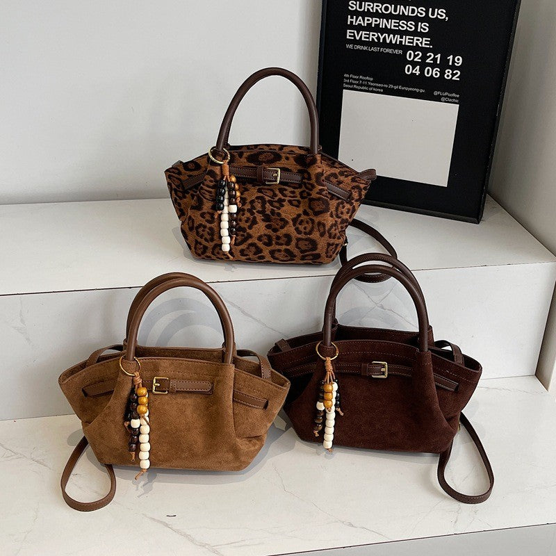 Faux Suede Belted Winged Top Handle Bag