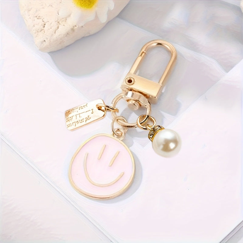 Smiley Face Enamel Bag Charm Keychain - Pink