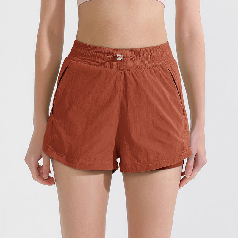Curved Hem Lined Running Shorts With Zip Pocket - Rust