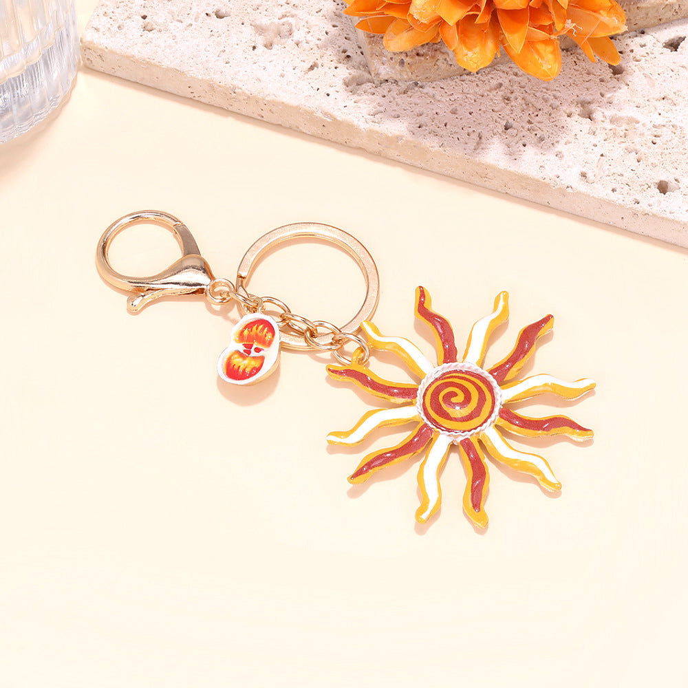 Enamel Swirl Sun Bag Charm Keychain - Gold
