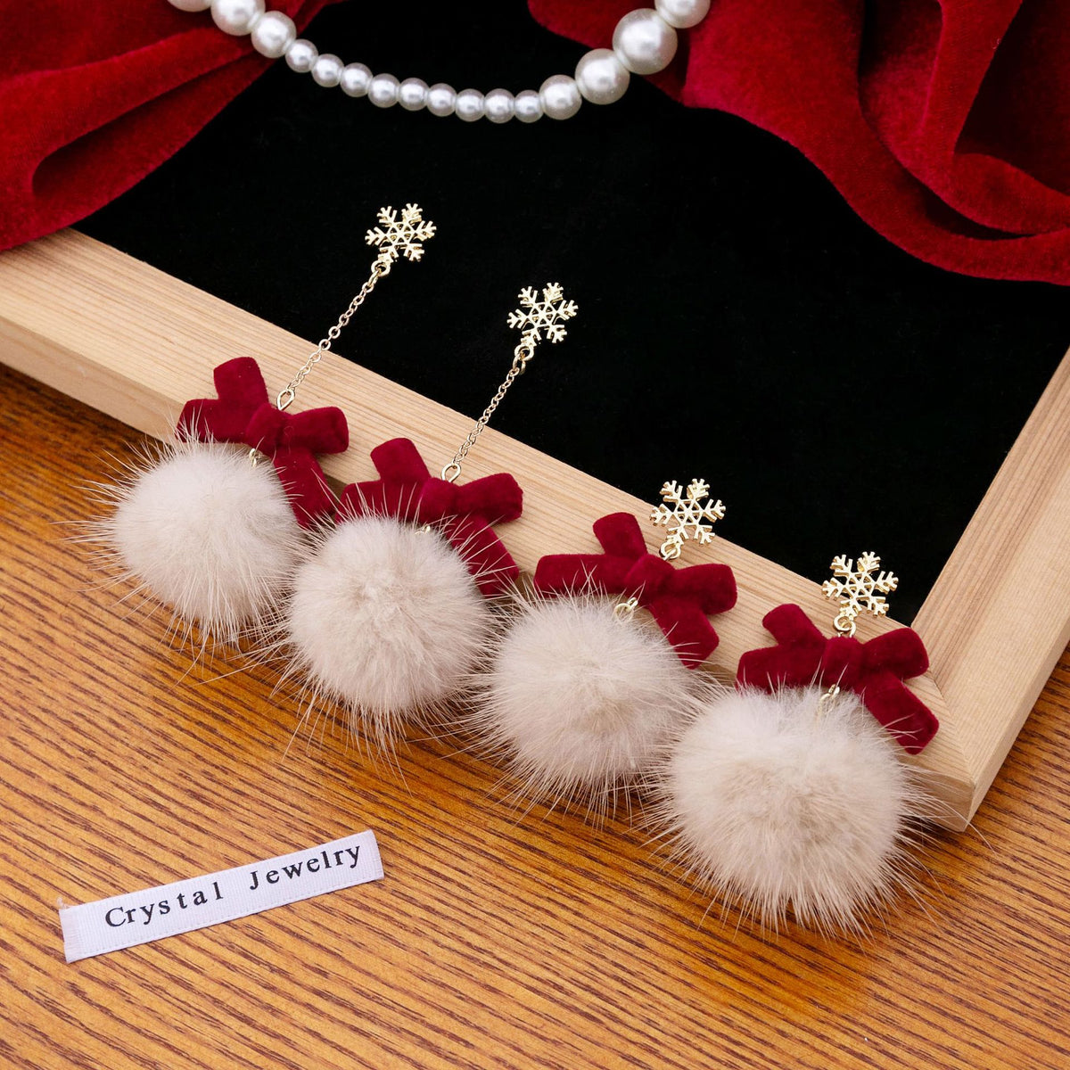 Snowflake Bow Pom Pom Dangle Earrings - view 1